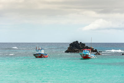 View of sailboat in sea against sky