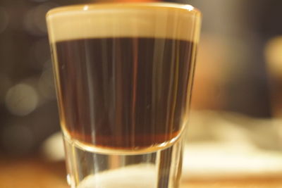 Close-up of coffee in glass on table