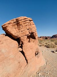 Rock formations in desert against sky