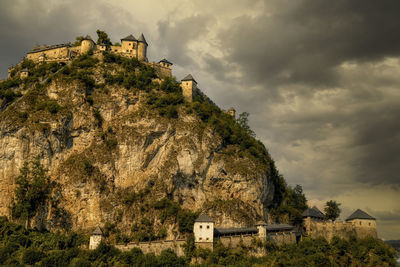 Low angle view of castle on hill against sky