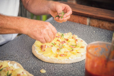 Midsection of man preparing food