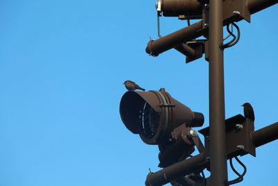 Low angle view of built structure against clear blue sky