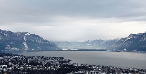 Scenic view of mountains against cloudy sky