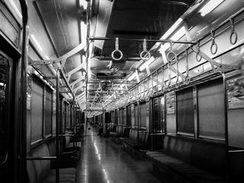 Train in illuminated underground walkway