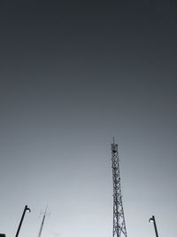 Low angle view of communications tower against sky