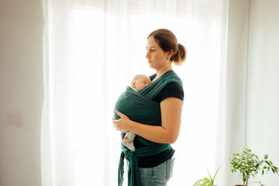 Mother and daughter standing on floor