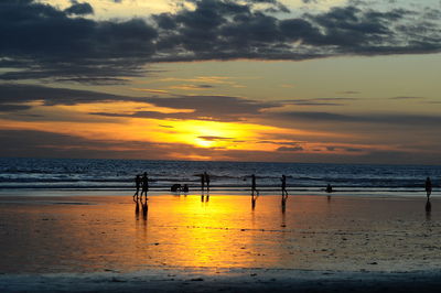 Scenic view of beach against sky during sunset