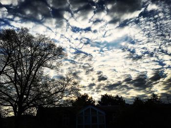 Low angle view of building against cloudy sky