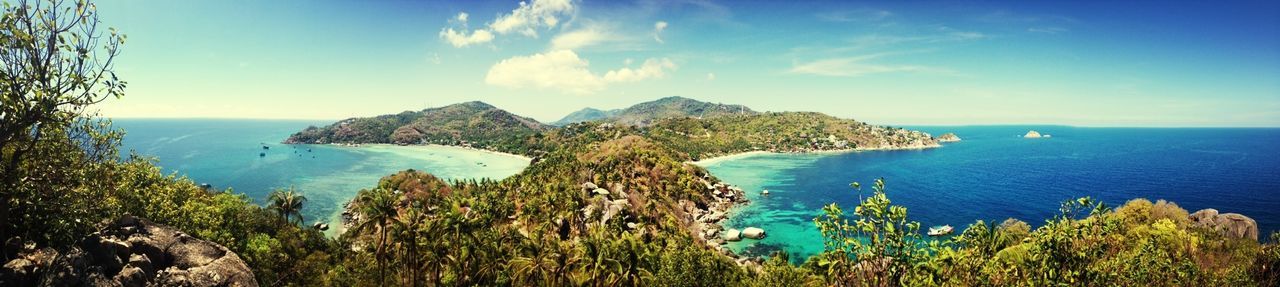 sea, tranquil scene, water, scenics, tranquility, horizon over water, beauty in nature, sky, blue, nature, mountain, cliff, idyllic, rock formation, coastline, high angle view, day, rock - object, cloud, tree