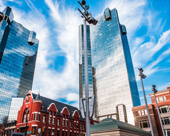 Low angle view of skyscraper in fort worth, texas with bright blue skies