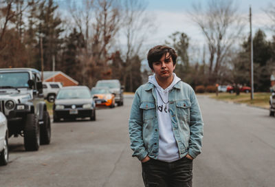 Portrait of teenage boy standing on street