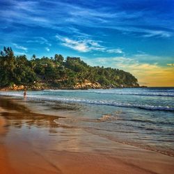 Scenic view of beach against sky