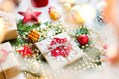 Christmas, new year background with decorations and presents wrapped in craft paper with snowflakes.