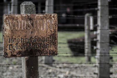 Close-up of old wooden post