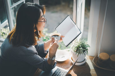 Young woman using phone