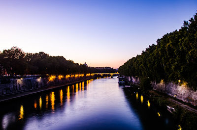 River amidst trees against clear sky