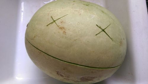 High angle view of anthropomorphic face on watermelon