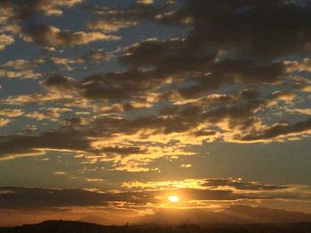 Scenic view of dramatic sky during sunset