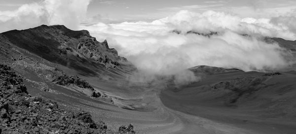 Scenic view of landscape against cloudy sky