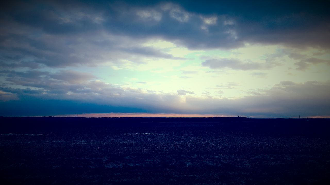 sky, tranquil scene, tranquility, landscape, scenics, silhouette, beauty in nature, sunset, cloud - sky, field, nature, horizon over land, cloud, cloudy, idyllic, dusk, non-urban scene, outdoors, remote, no people