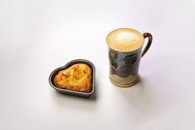 High angle view of coffee cup against white background