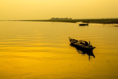 A sunset with the boatman i captured this image from munshegonj, bangladesh, asia