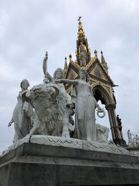 Low angle view of statue against building