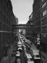 High angle view of traffic on street amidst buildings