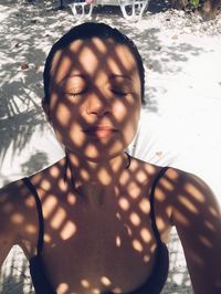 Portrait of young woman in swimming pool