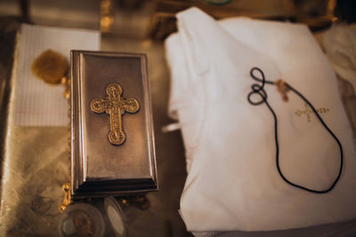 High angle view of cross on table