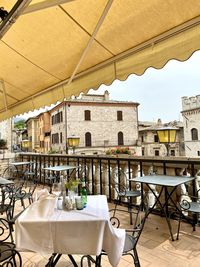 Empty chairs and tables in restaurant in assisi