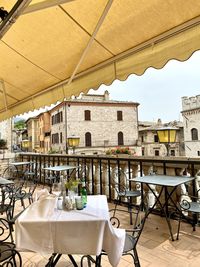 Empty chairs and tables in restaurant