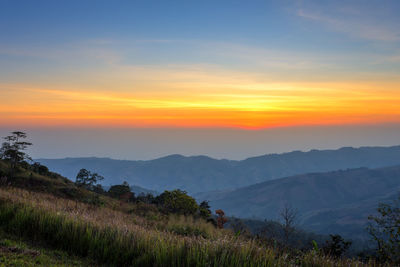 Scenic view of landscape against sky during sunset