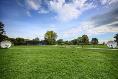 Scenic view of soccer field against sky