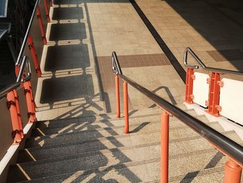 High angle view of staircase by railing in city