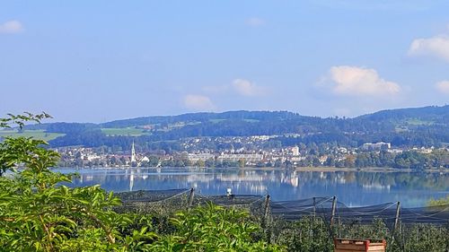 Scenic view of lake and mountains against sky