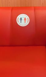 High angle view of text on red wall