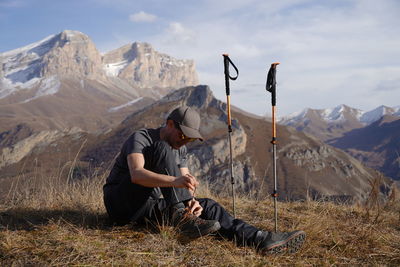 Full length of man skiing on land against sky