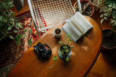 High angle view of a table with books and coffee