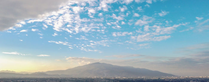 Scenic view of snowcapped mountains against sky during sunset