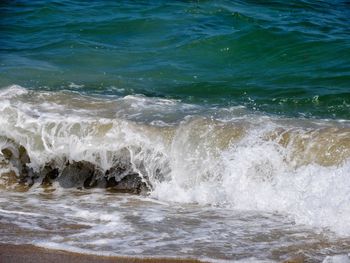 Waves splashing on rocks