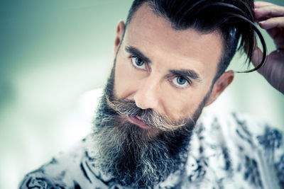 Close-up portrait of confident hipster