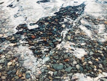 High angle view of stones on beach