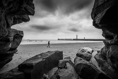 Scenic view of sea against cloudy sky