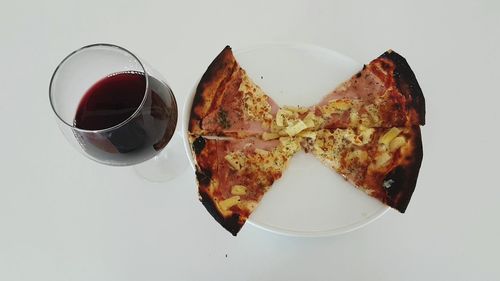 High angle view of drink on plate against white background