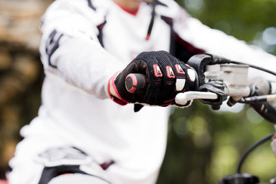 Italy, motocross biker rinding in tuscan forest