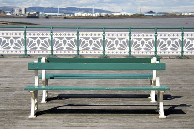 Empty bench in sea