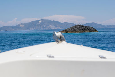 Sailboat sailing in sea against sky