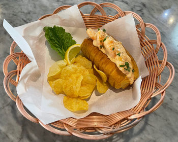 High angle view of ice cream in basket on table