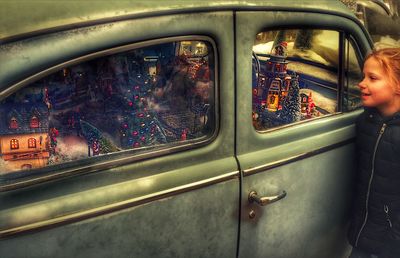 Reflection of man on car window